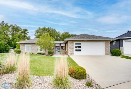 Custom-built slab-on-grade riverside home on 1+ acre!