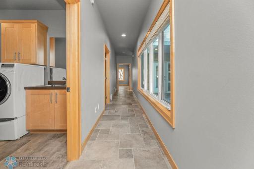 Hallway back to Foyer, Kitchen, Living, Dining