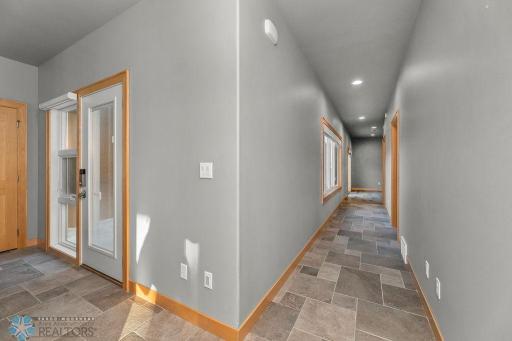 Hallway to bedroom wing on opposite side of home