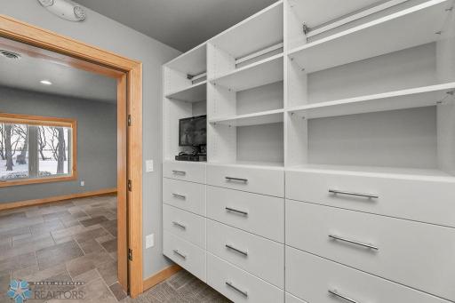 Master walk-in closet w/ built-in closet system.