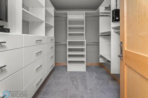 Master walk-in closet w/ built-in closet system.