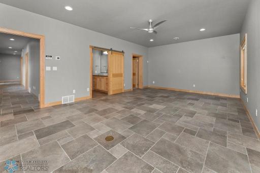 Master Bedroom is spacious with high ceilings, double windows, recessed lighting, ceiling fan, walk-in closet & private 3/4 bath!