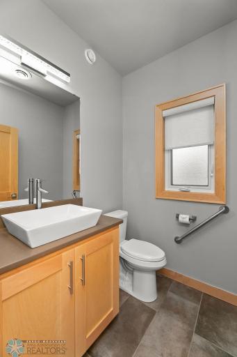 Half bath conveniently placed near garage entry
