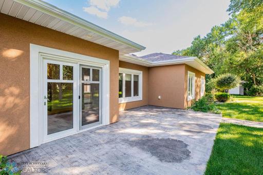 Stamped concrete patio offers a great space to relax, grill, entertain, & more!