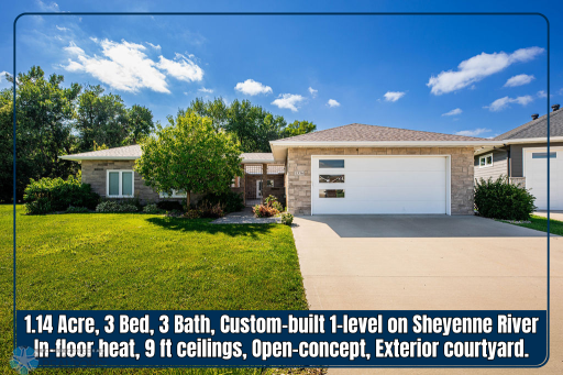 Custom-built slab-on-grade riverside home on 1+ acre!