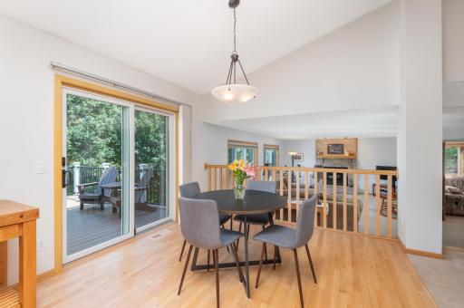 Informal Dining Area walks out to Deck. Note the newly refinished hardwood floors