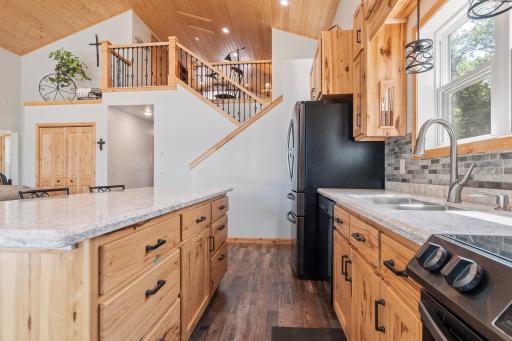 Sleek and durable quartz countertops add to the modern finishes throughout this kitchen!