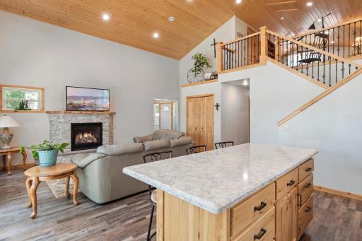 A center island offers seating for casual meals and extra storage/prep space.