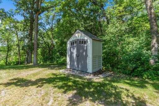 Spacious utility shed to keep your outdoor tools secure and organized.