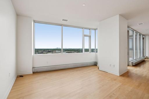 Den is open to the main living area, and features a perfect spot for your big screen TV or home office with a view.