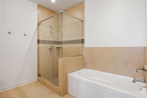 Unwind in the soaking tub or refresh in the glass walk-in showerâluxury choices to suit your mood.