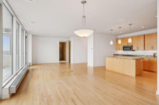 The kitchen flows seamlessly into the living, dining, and den areasâperfect for cooking, entertaining, and enjoying the views.