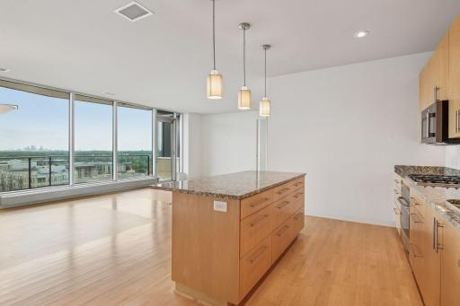 Walls of windows mean your cooking experience always comes with a viewâsuburban vistas by day, skyline lights by night.