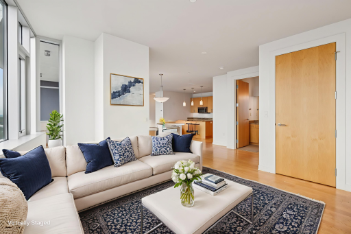Enjoy the open, airy flow from the den to the main living area providing an out of the way TV room or home office without a closed off feeling. (Virtually staged)