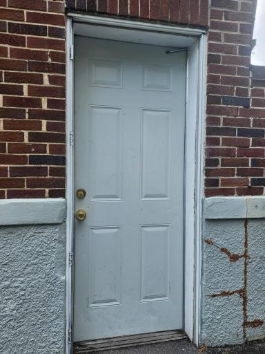 Side door entrance to common laundry area