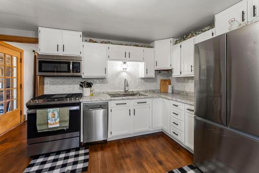 Bright inviting kitchen with Stainless Appliances