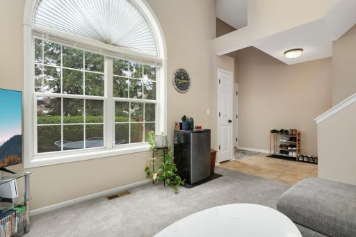 The natural light pours in the 2 story living room!