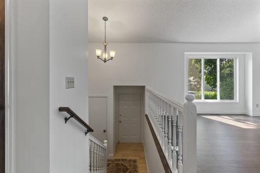 Entryway & Garage Door Access - Headed Downstairs To Two More Bedrooms, Family Room and Laundry Room
