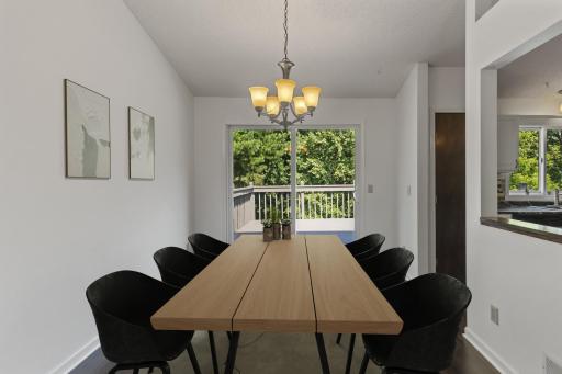 Separate Dining Room With Easy Access To The Kitchen & The Deck - Digitally Staged To Show Optimal Potential