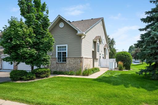 Beautifully updated end-unit with loads of green space.