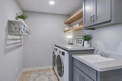 Walk through 2nd level laundry, adjacent walk-in closet