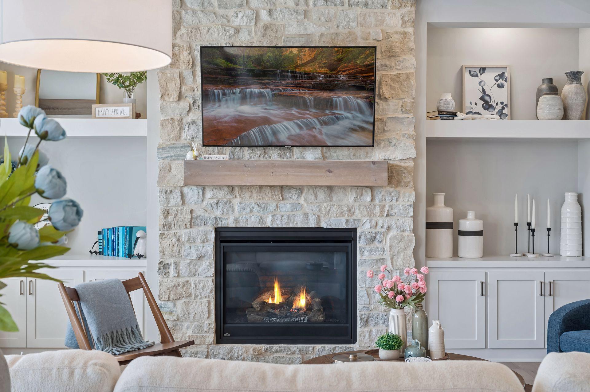 Stone fireplace is beautiful focal point of main level living room