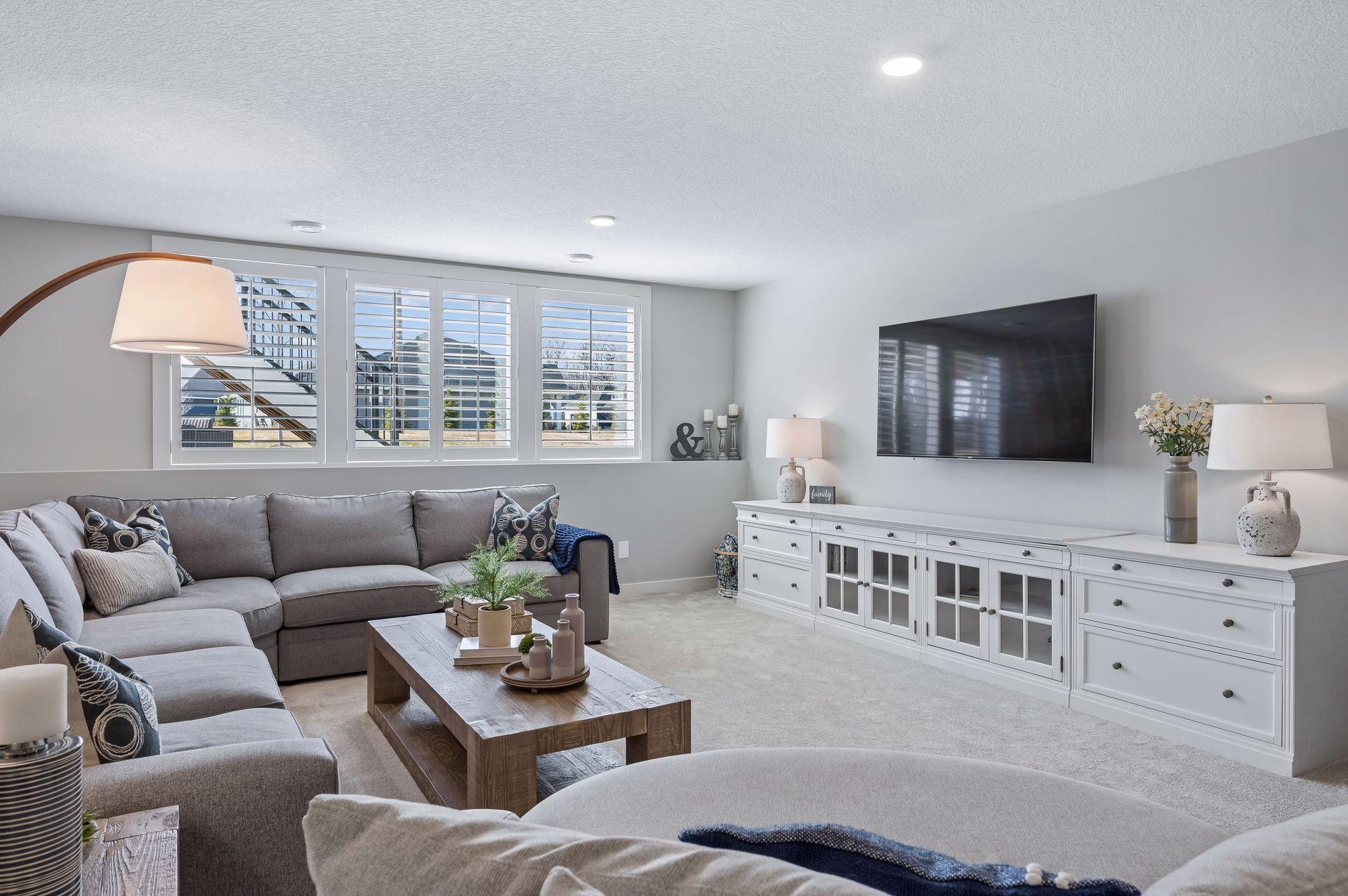 Lower level wall of windows allows natural light to pour in