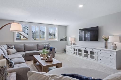Lower level wall of windows allows natural light to pour in