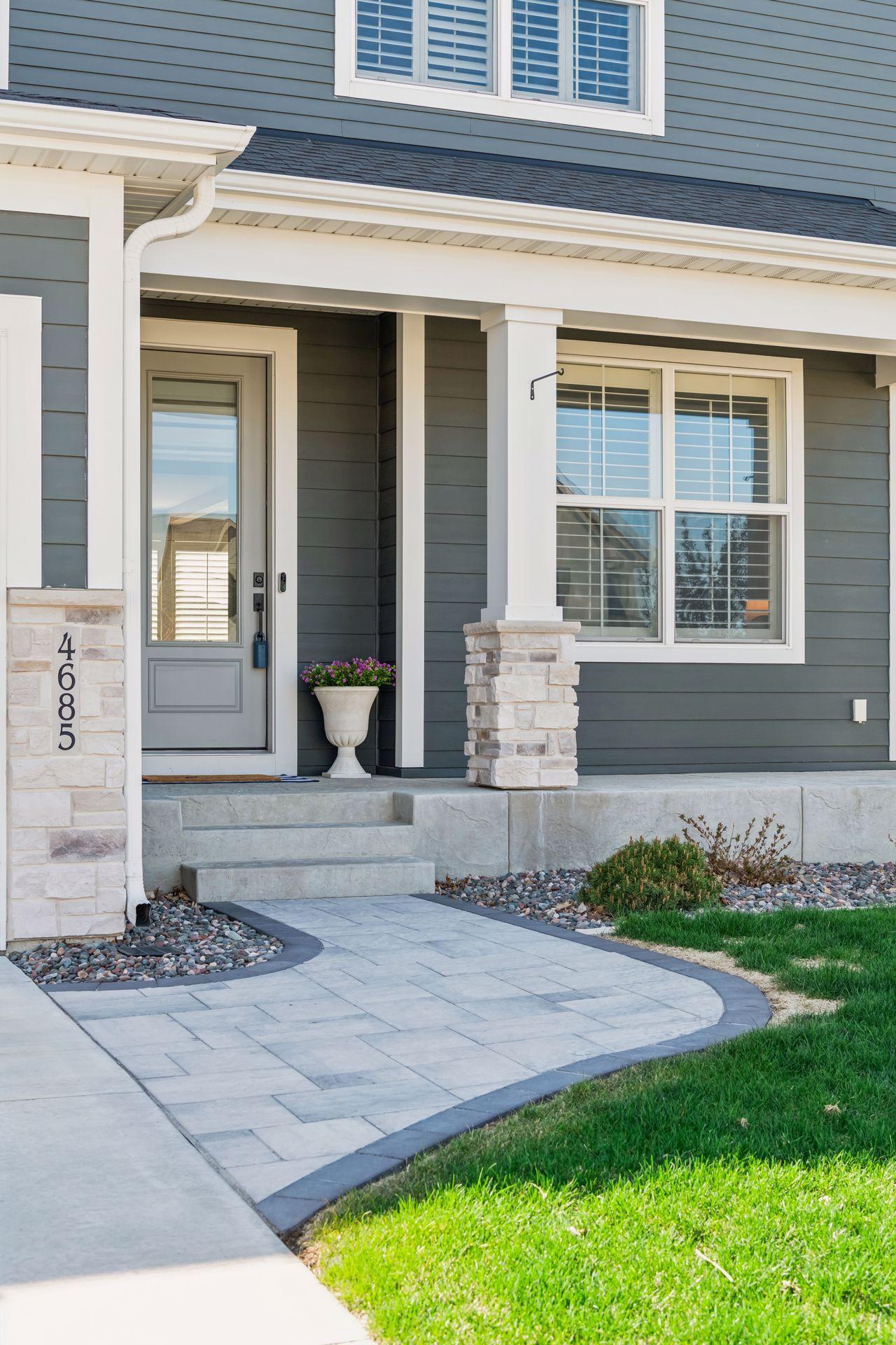 Pristine hard and soft landscaping welcomes you to 4685 Garland Lane