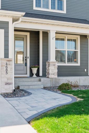 Pristine hard and soft landscaping welcomes you to 4685 Garland Lane