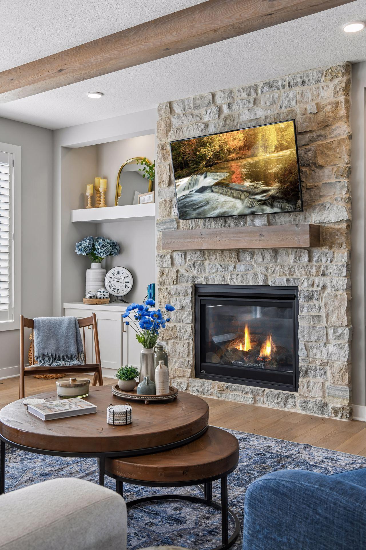 Wood mantel ties white oak floors to ceiling beams