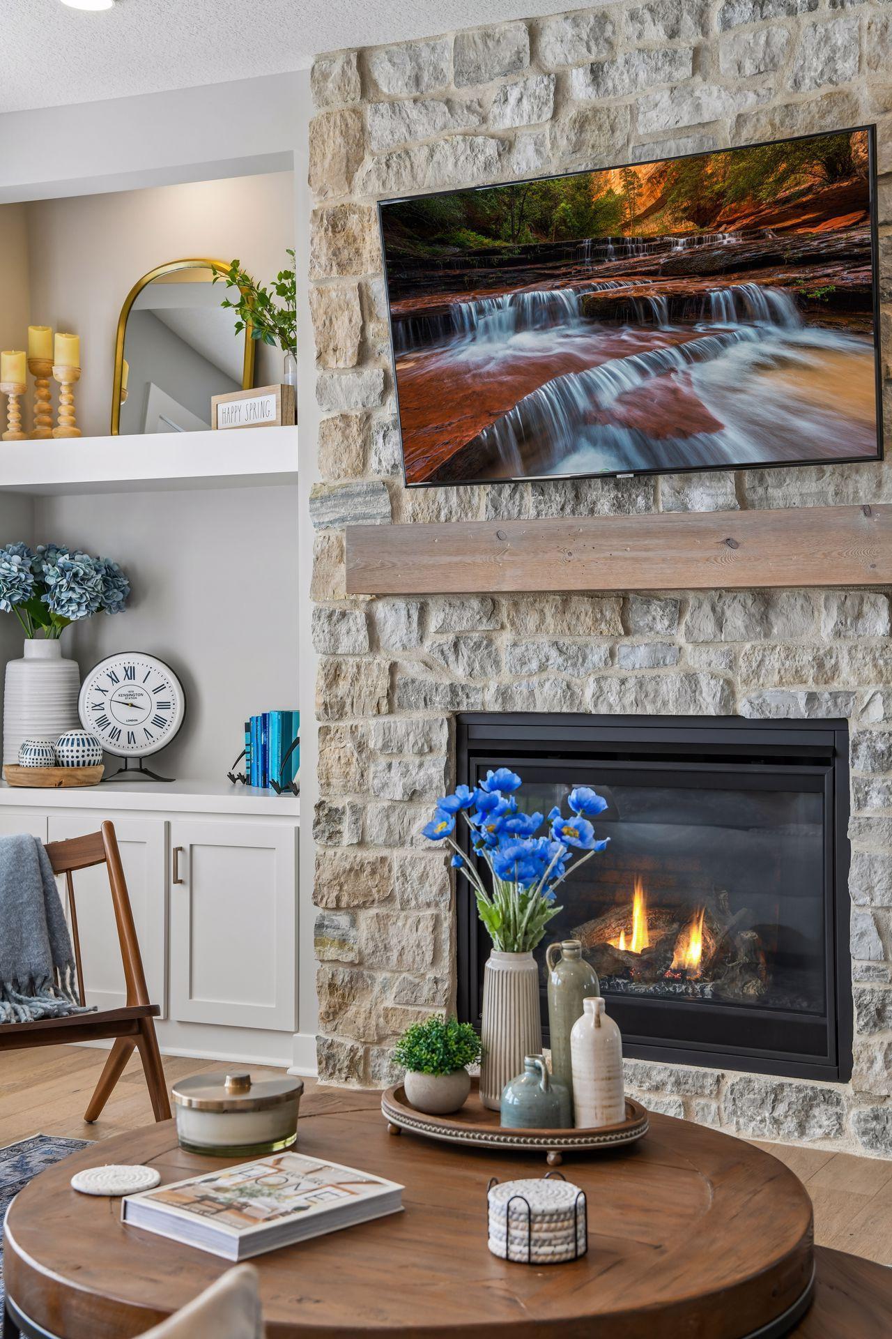 Floor to ceiling stone fireplace is a gorgeous focal point