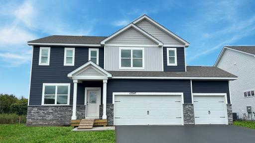 Photo is of actual home. Sod and driveway are not installed yet.
