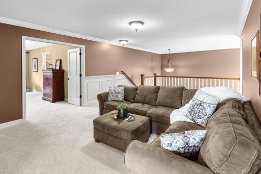 Upper-level loft area is ideal as a family room, playroom, workout space, or study.