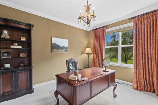 Main level office offers privacy for working from home or reading.
