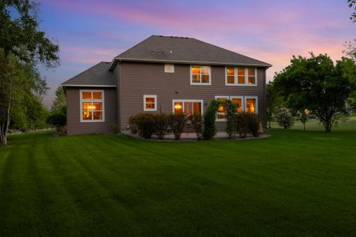 Gorgeous landscaping creates a peaceful setting for outdoor dining, gardening, or play.