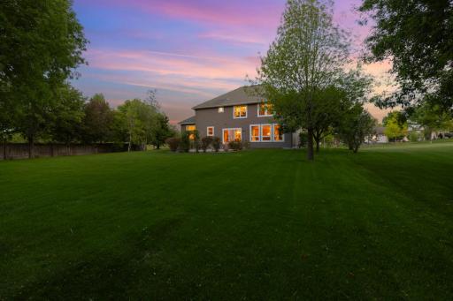 Beautifully landscaped front and back yards offering lush greenery and curb appeal.