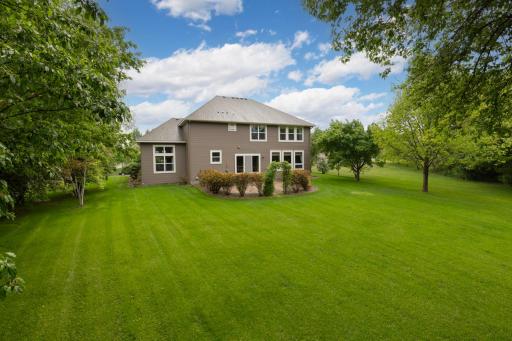 Enjoy the serenity of nature right in your own backyardâthis expansive outdoor space is surrounded by mature trees, offering both privacy and natural beauty year-round.