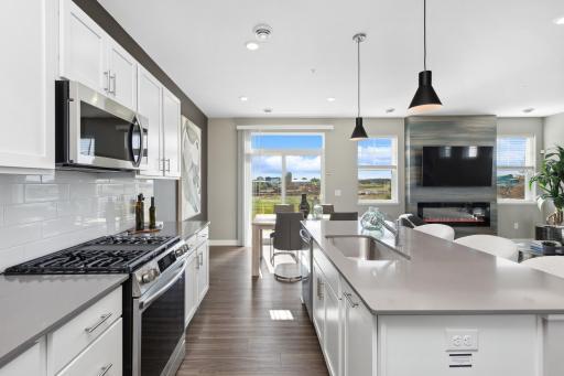 (Photo of model home)Socialize while making your favorite meal!