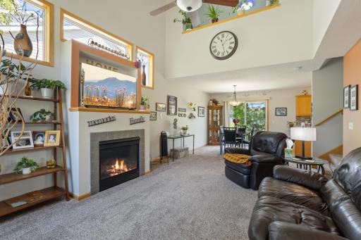 Spacious living room with a gas fireplace and lots of natural light.
