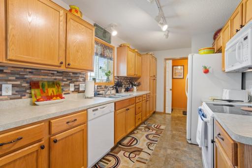 You will love the beautiful tile backsplash, window over the sink and all the cabinets and counter space!