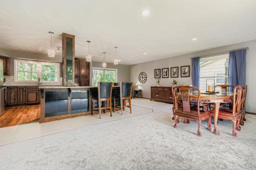 The heart of this home is a remodeled kitchen that flows seamlessly into a spacious open-concept great room ideal for hosting gatherings or enjoying a cozy night at home.