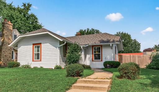 Welcome to 4530 Xerxes Avenue N - An adorable bungalow perched up on a hill smiling to the neighborhood with her new roof, metal siding, window wraps and gutters!