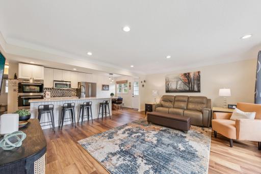View from the front door. Luxury vinyl flooring, recessed lights and open floor plan..jpeg