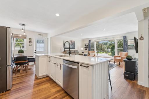 Eat in kitchen and acess to the side porch and fenced in yard.jpeg