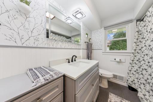 Main level updated full bathroom. Beautiful finishes..jpeg
