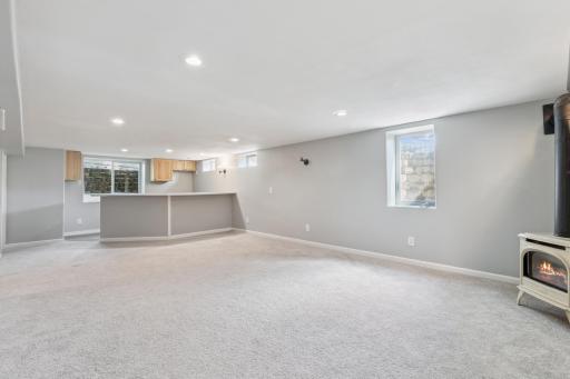 Lower level family room with bar, 2 fireplaces (gas and electric) and flat screen TV included!.jpeg
