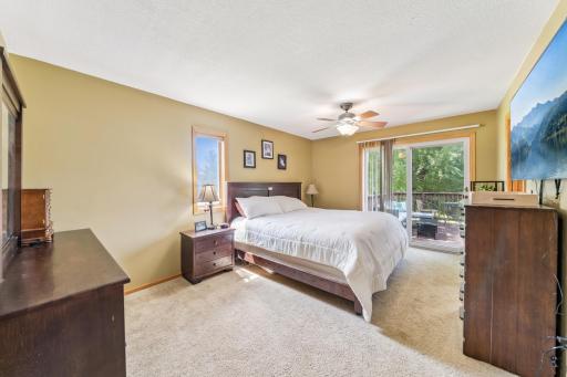 The primary bedroom features a sliding glass door that walks out onto the deck!