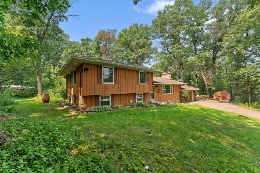 Welcome Home! Extra parking and turn around area on side of garage, storage shed for extra lawn equipment