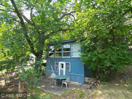 Charming cabin nestled in the trees overlooking the crystal-clear waters of Lake Sylvia.